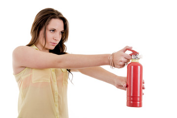 The image of young woman with extinguisher on white - obrazy, fototapety, plakaty