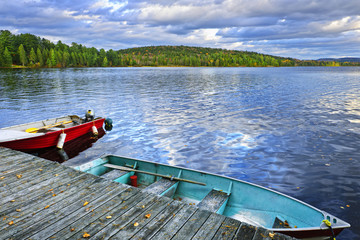 Rowboats on lake at dusk