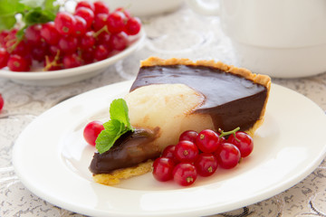 Chocolate tart with pears. Selective focus.