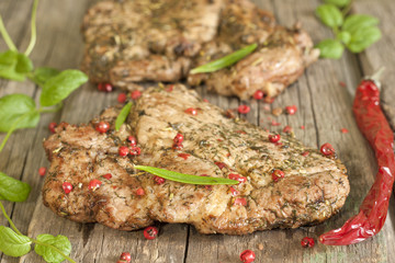 Grilled pork steak meat with herbs and spices