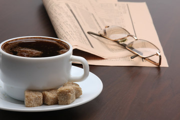 Cup of coffee near press