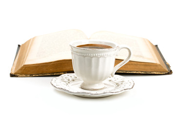 cup of coffee and old book