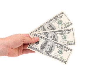 Male hand holding american Dollar-bills.