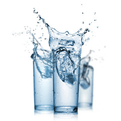 water splash in glasses isolated on white