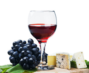 glass of red wine with grapes