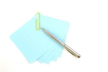 Colorful note paper with clips isolated on white background