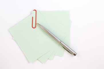 Colorful note paper with clips isolated on white background