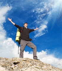 Man on top of mountain.