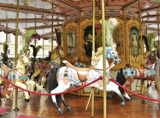 Colorful horses on a merry go round