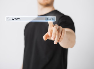 male hand pressing Search button