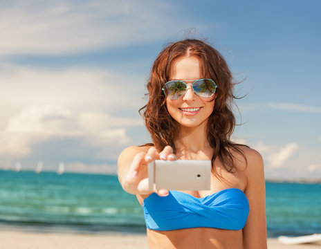 woman in bikini and sunglasses