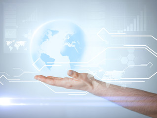hand holding virtual sphere globe