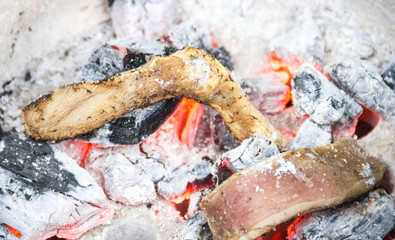 Cow skin burned on charcoal.