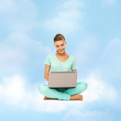 woman sitting on the cloud with laptop