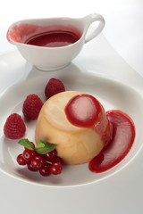 Mousse cake with raspberry dressing and fresh berries