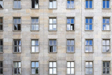 old facade with sky mirroring in the windows