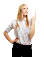 A young woman pointing at something