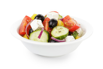 fresh greek salad in white bowl