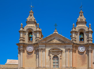 Fototapeta na wymiar Detail of the St Paul’s cathedral towers in Mdina in Malta