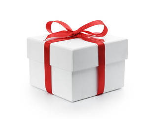 white textured gift box with red ribbon bow