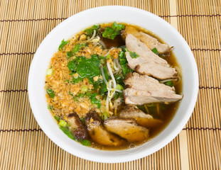 Duck noodle soup on bamboo