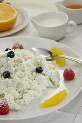 Cottage cheese with fresh fruits breakfast