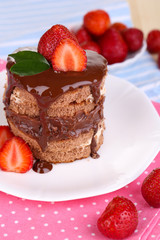 Chocolate cake with strawberry on table close-up
