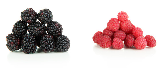 Ripe raspberries and blackberries isolated on white
