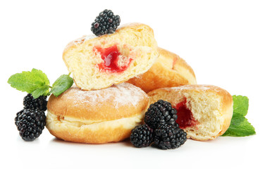 Tasty donuts with berries, isolated on white