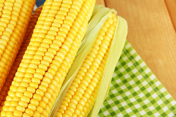 Crude corns on napkin on wooden table