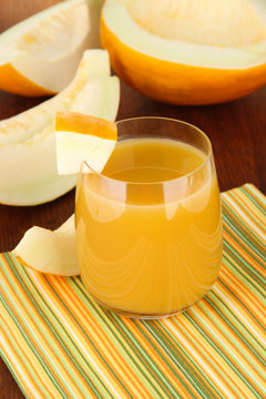 Delicious juice of melon on table close-up
