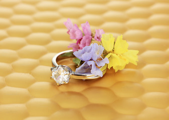 Wedding ring on bright background