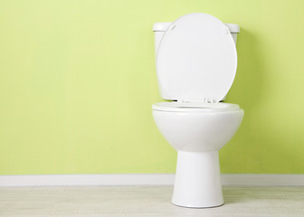 White toilet bowl in a bathroom - 55671142