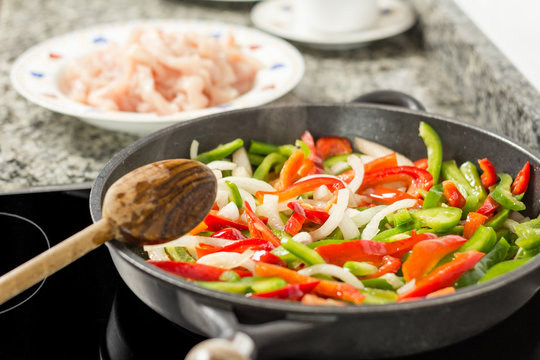 Closeup Of Cooking Vegetables And Chicken In A Pan