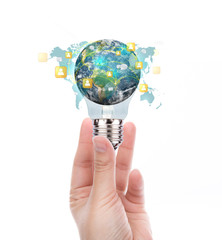 Hand hold Light Bulb with earth of social network (Elements of t