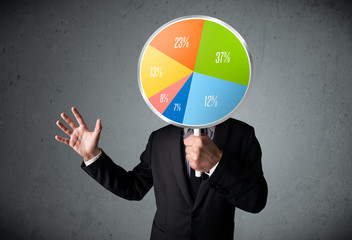 Businessman holding a pie chart