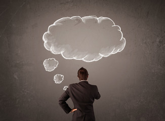 Businessman with cloud thought above his head