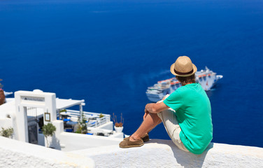 Fototapeta na wymiar tourist looking at the sea in Santorini