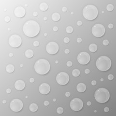 Water drops on grey background.
