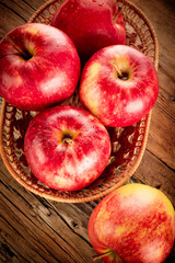 Fresh organic ripe apple fruits on old wooden table