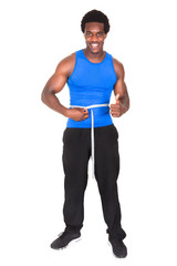 Bodybuilder With A Measuring Tape Around His Waist