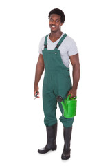 Gardener With Watering Can And Pliers