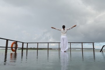 young woman relax on cloudy summer day