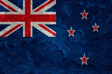 Foto op Canvas New Zealand flag on grunge concrete wall © NatasaAdzic