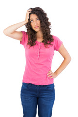 Troubled cute brunette posing