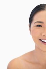 Obraz premium Half face of smiling natural model