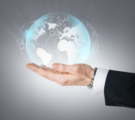 hand holding virtual sphere globe