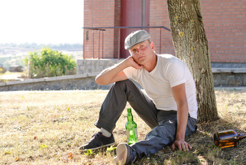 Alcoholic sitting thinking