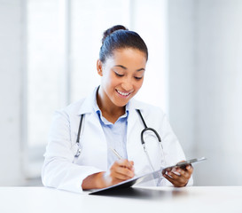 female doctor writing prescription