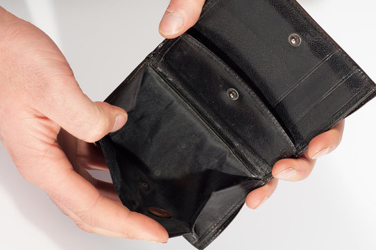 Hands holding an empty black wallet. Isolated on white